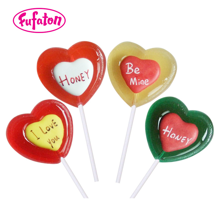 Red color Heart shaped candy lollipops