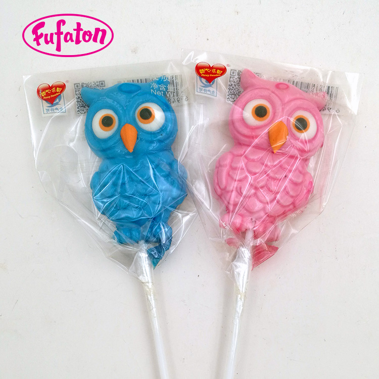 Owl shaped candy lollipop with hand decoration